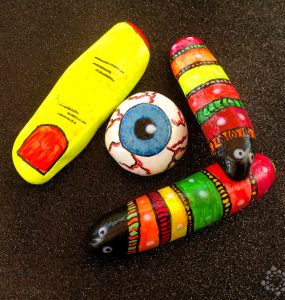 Stones painted with fluorescent paints of halloween